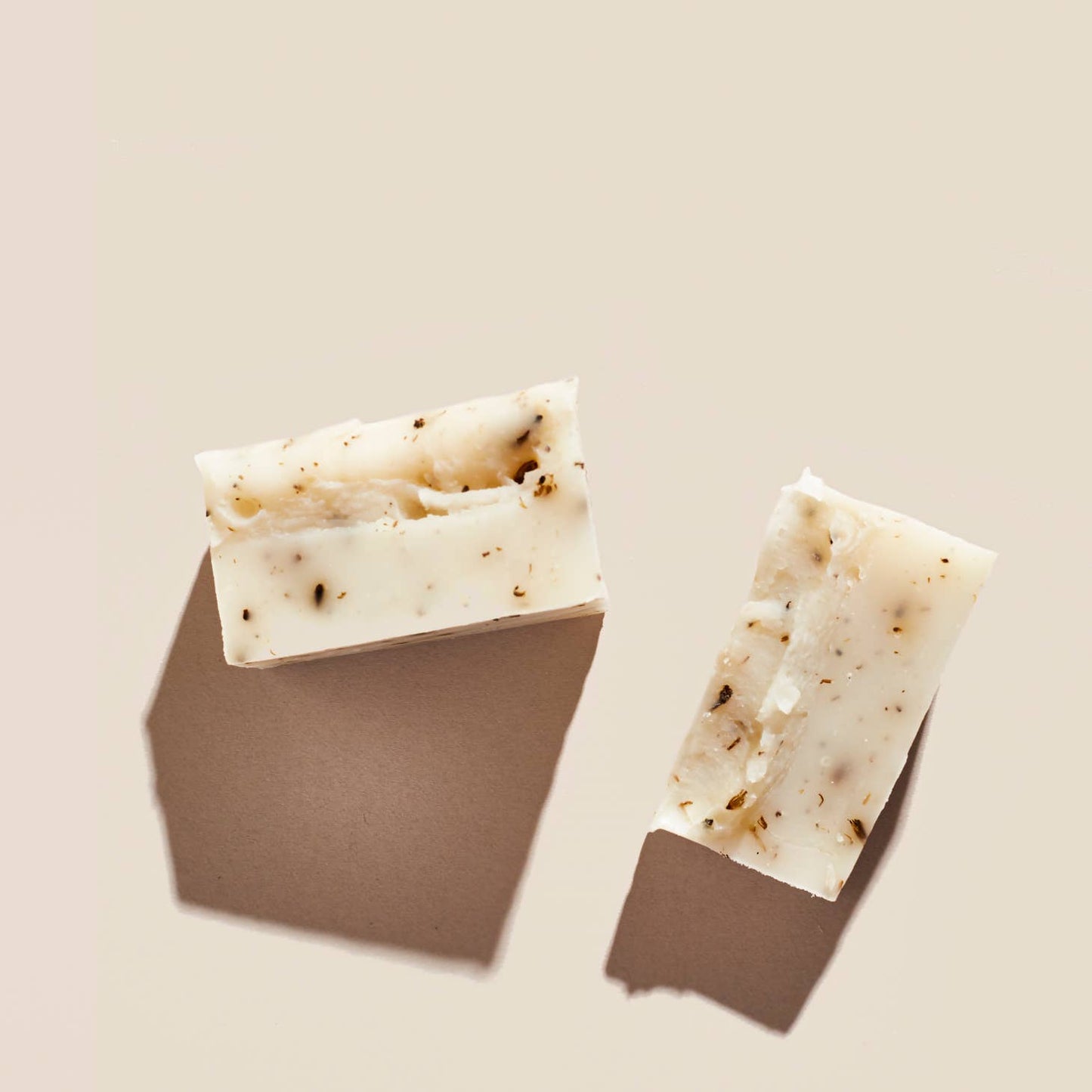 Palermo's Lavender + Sage soap bar, shown broken in half.