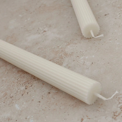 Sunday Edition's Roman Taper Candles in Cream.