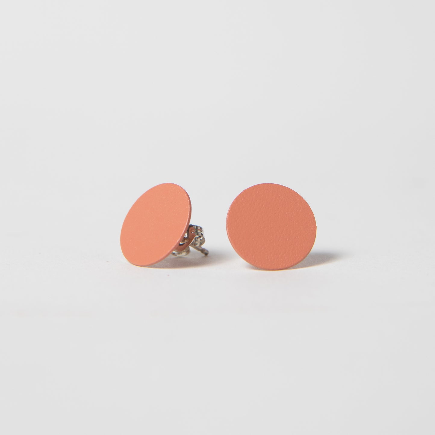 Round Brass earrings w/ Sterling Posts in coral.