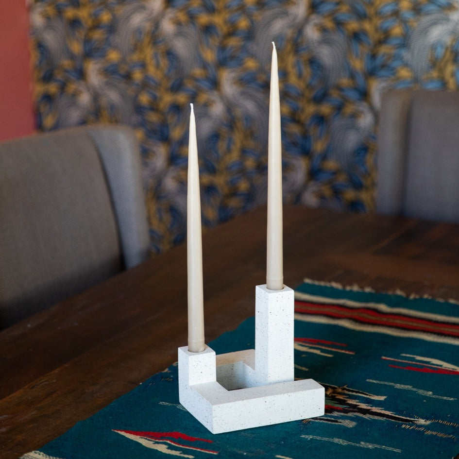 White Terrazzo Candlestick Set, styled on a table with taupe-colored tapers.