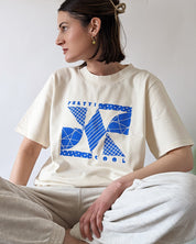 Memphis Tee in cream w/ blue print on model.