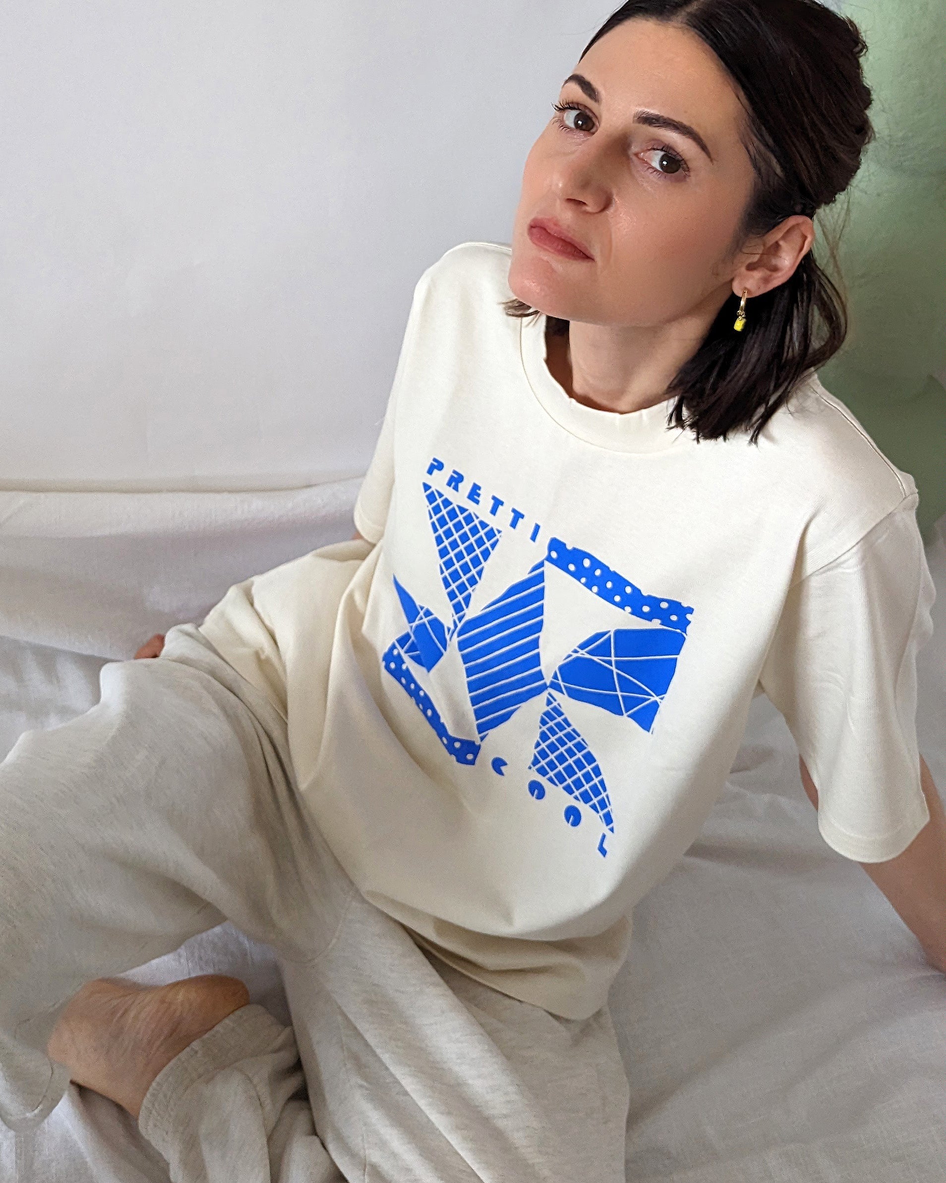 Memphis Tee in cream w/ blue print on model.