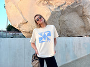 Memphis Tee in cream w/ blue print on model.