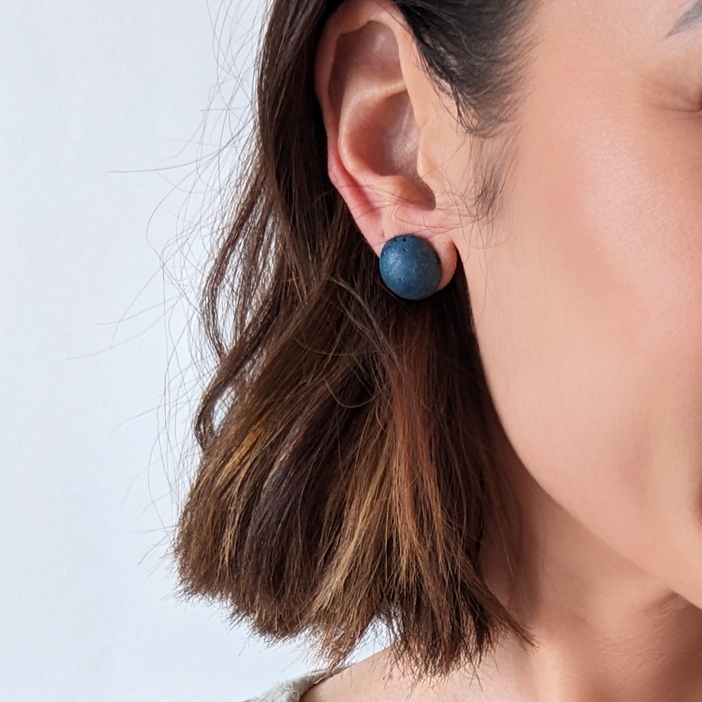 Pretti.Cool's Dome Earrings in Cobalt Terrazzo on a model.