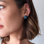 Pretti.Cool's Dome Earrings in Cobalt Terrazzo on a model.