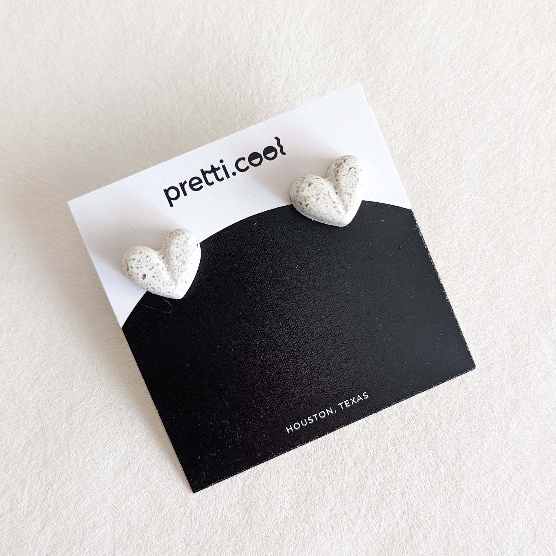 Pretti.Cool's Chunky Heart Earrings in White Terrazzo.