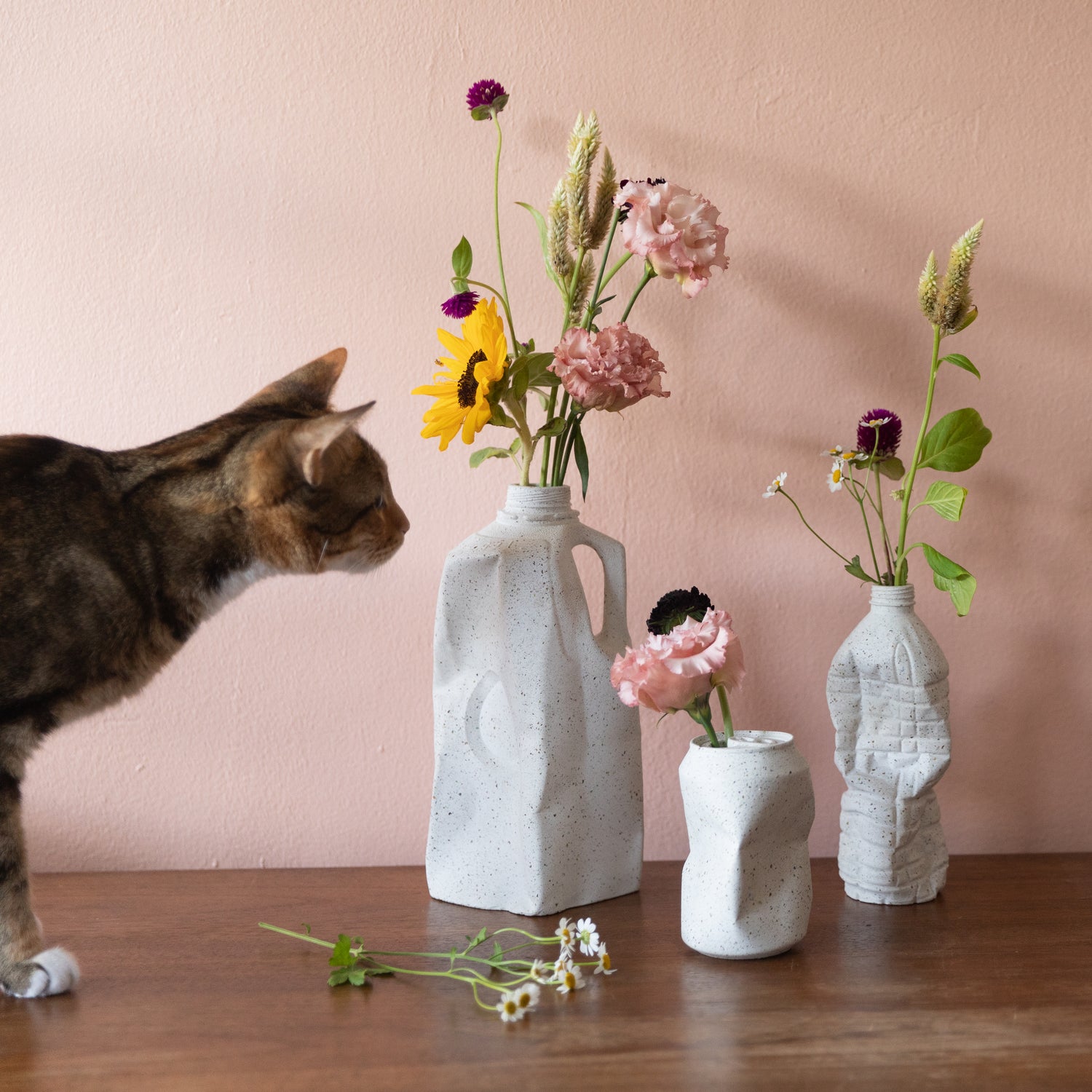 The Complete Set of Vases from our Garbage Collection in white terrazzo, styled with flowers.