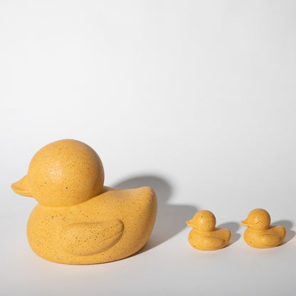 Large and mini "rubber" duckies in marigold terrazzo.