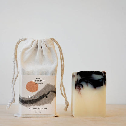 Bell Mountain Naturals' Solstice soap bar, shown next to its packaging.