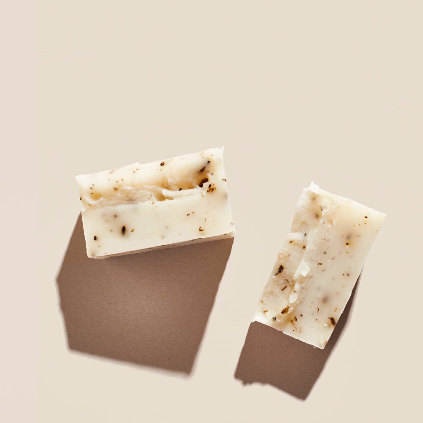 Palermo's Lavender + Sage soap bar, shown broken in half.