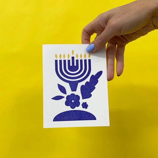 Meshworks Press Products Happy Hanukkah Card, held in a hand for scale