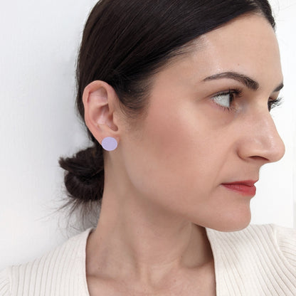 Round Brass earrings w/ Sterling Posts on woman.