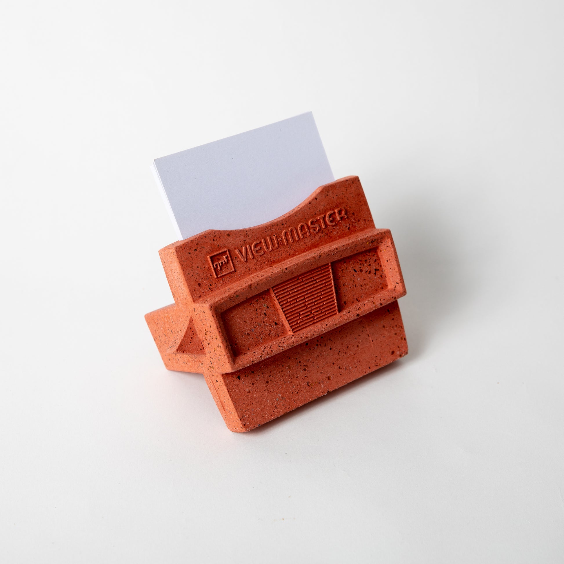 The Retro Business Card Holder in Coral Terrazzo w/ blank business cards placed inside.