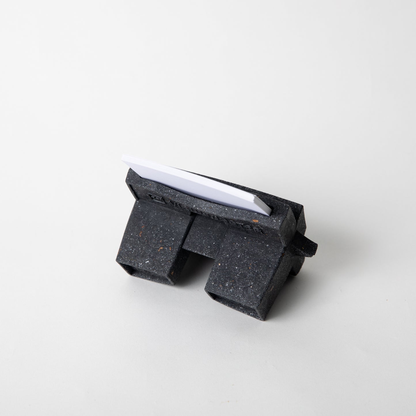 The Retro Business Card Holder in Black Terrazzo w/ blank business cards placed inside.