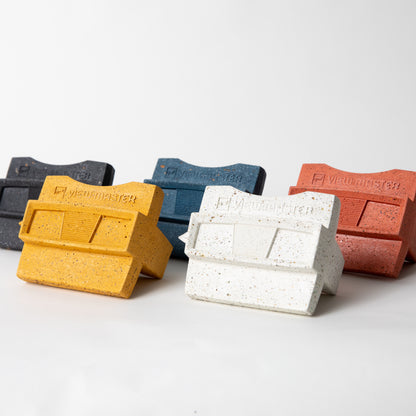 The retro business card holder in black, cobalt, coral, marigold, and white terrazzo.