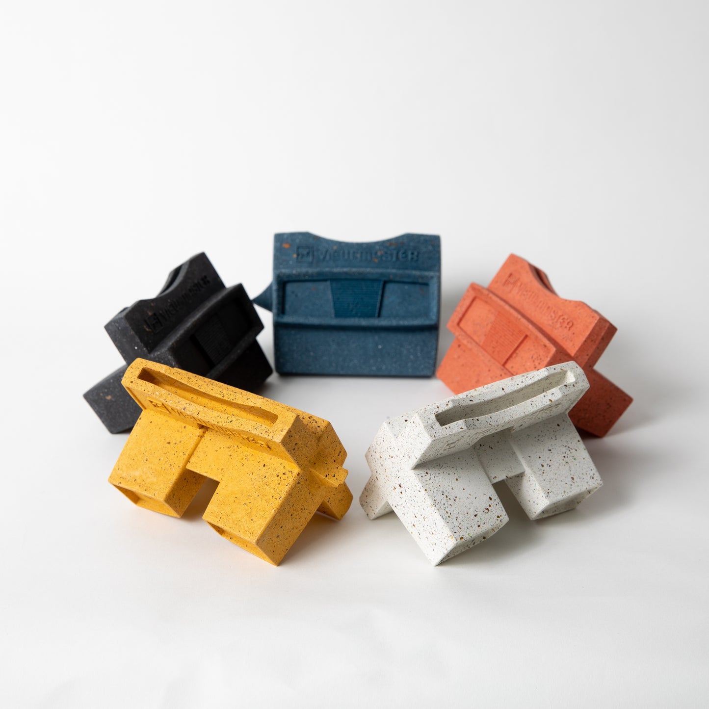 The retro business card holder in black, cobalt, coral, marigold, and white terrazzo.