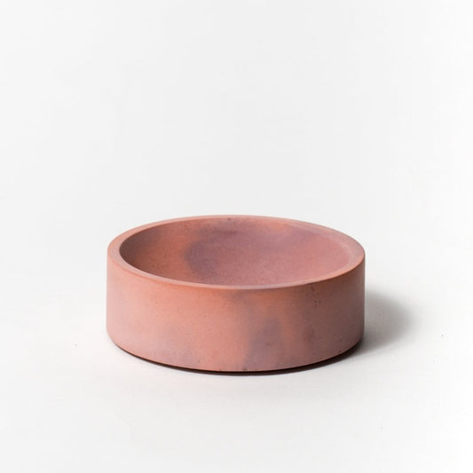 5 inch concrete catch all with cork base in coral and mauve.