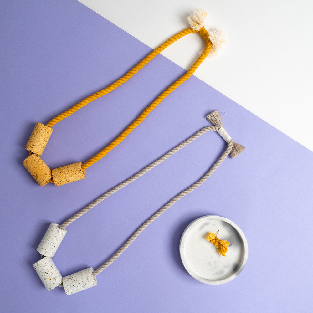 Dyed cotton rope necklace with handmade terrazzo beads in a few colors.