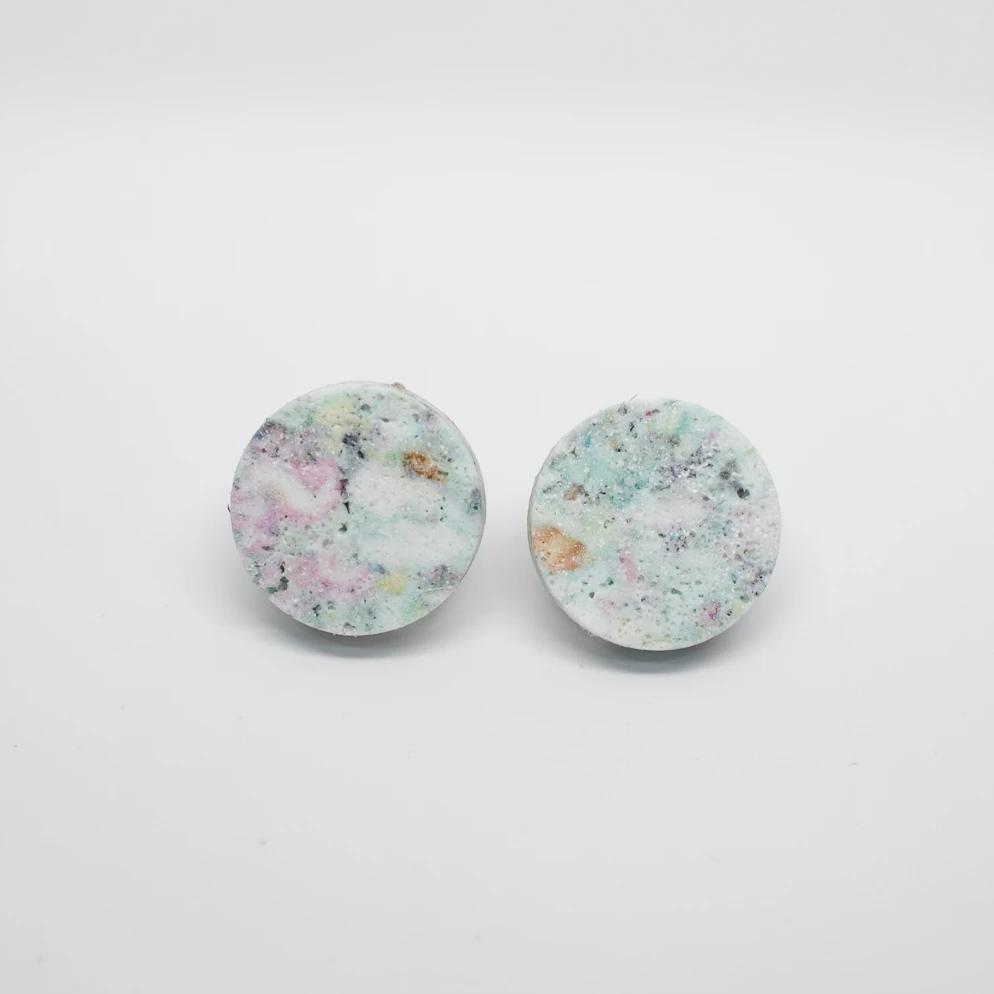 Round seafoam earrings in polymerized recycled foam, titanium posts.