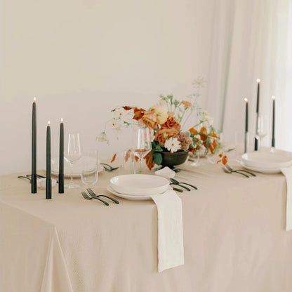 Mo&Co. Home Hand-Dipped Tapers in Charcoal, styled on a table.