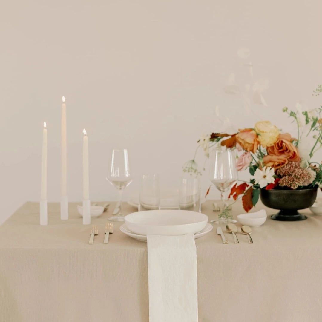 Mo&Co. Home Hand-Dipped Tapers in White, styled on a table.