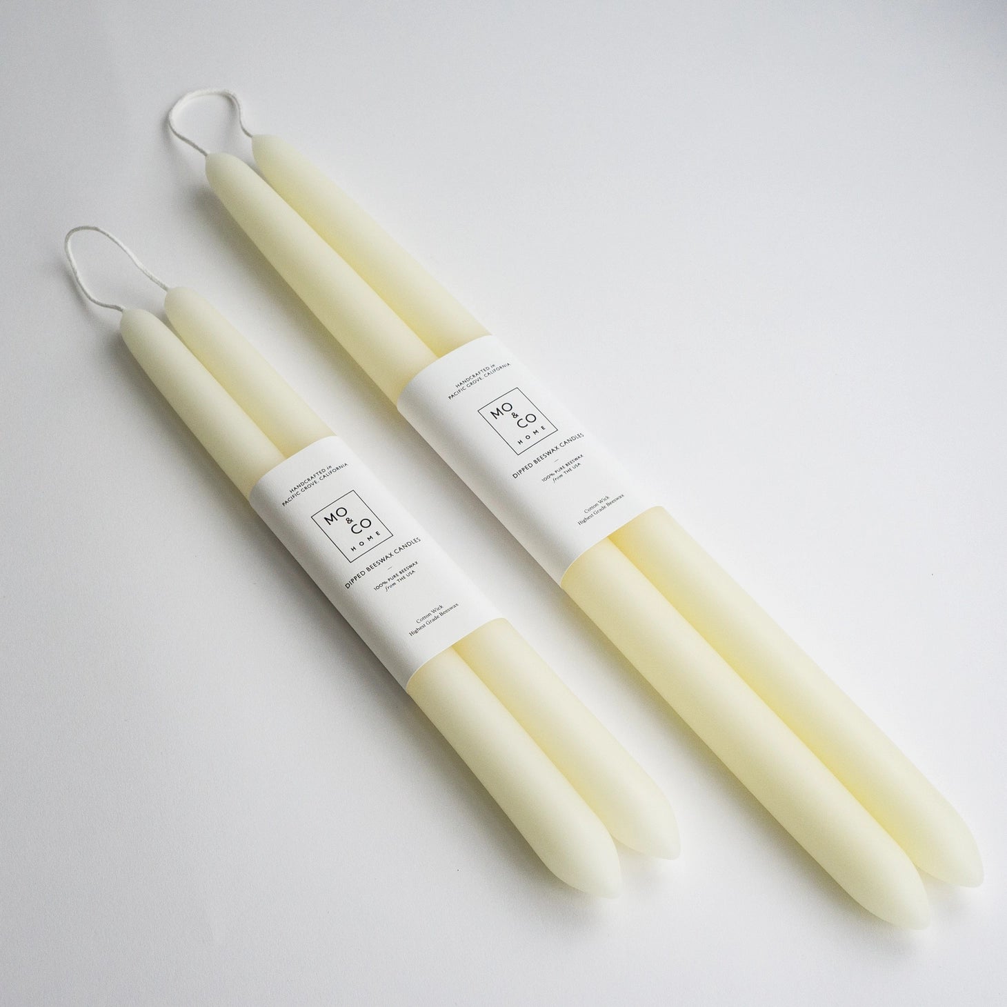 Mo&Co. Home Hand-Dipped Tapers in White.