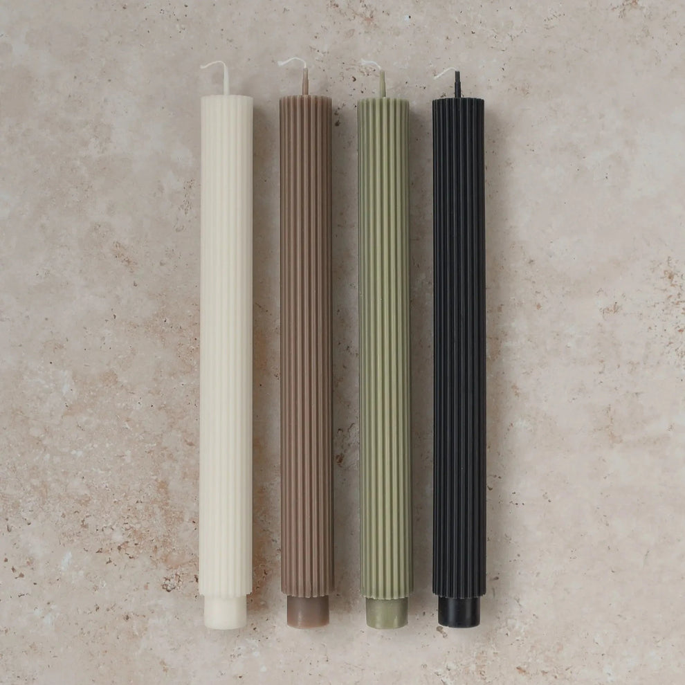 Sunday Edition's Roman Taper Candles in multiple colors.