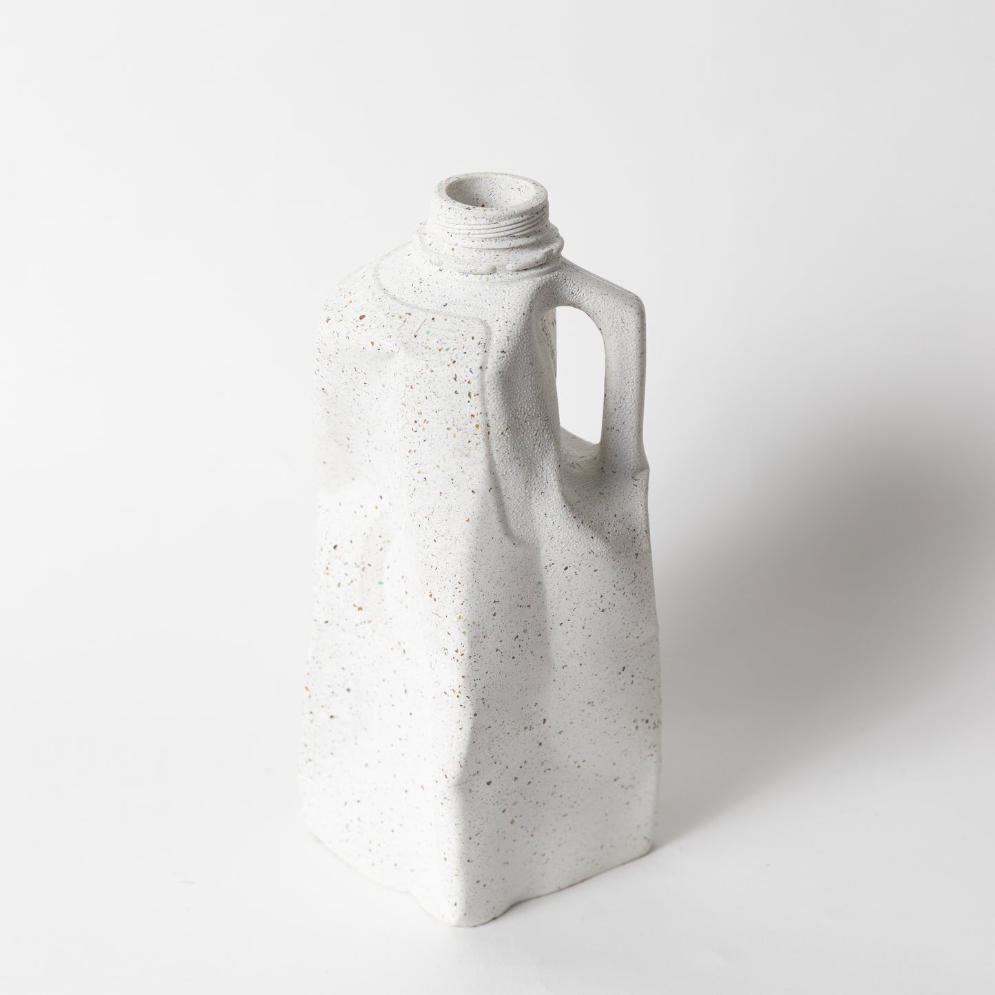 The white terrazzo milk carton vase from our Garbage Collection.