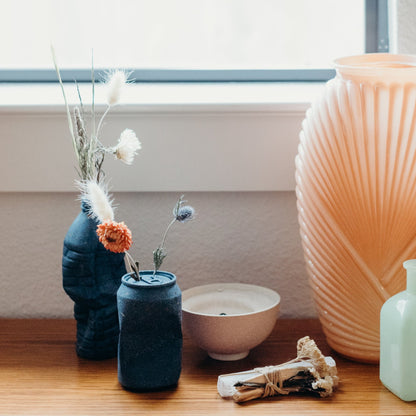The cobalt terrazzo soda can vase and water bottle vase from our Garbage Collection.