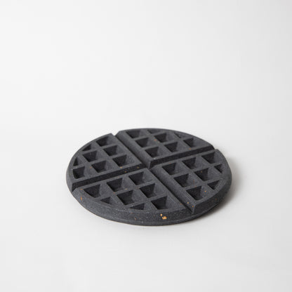 Concrete waffle shaped trivet in black
