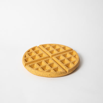 Concrete waffle shaped trivet in yellow