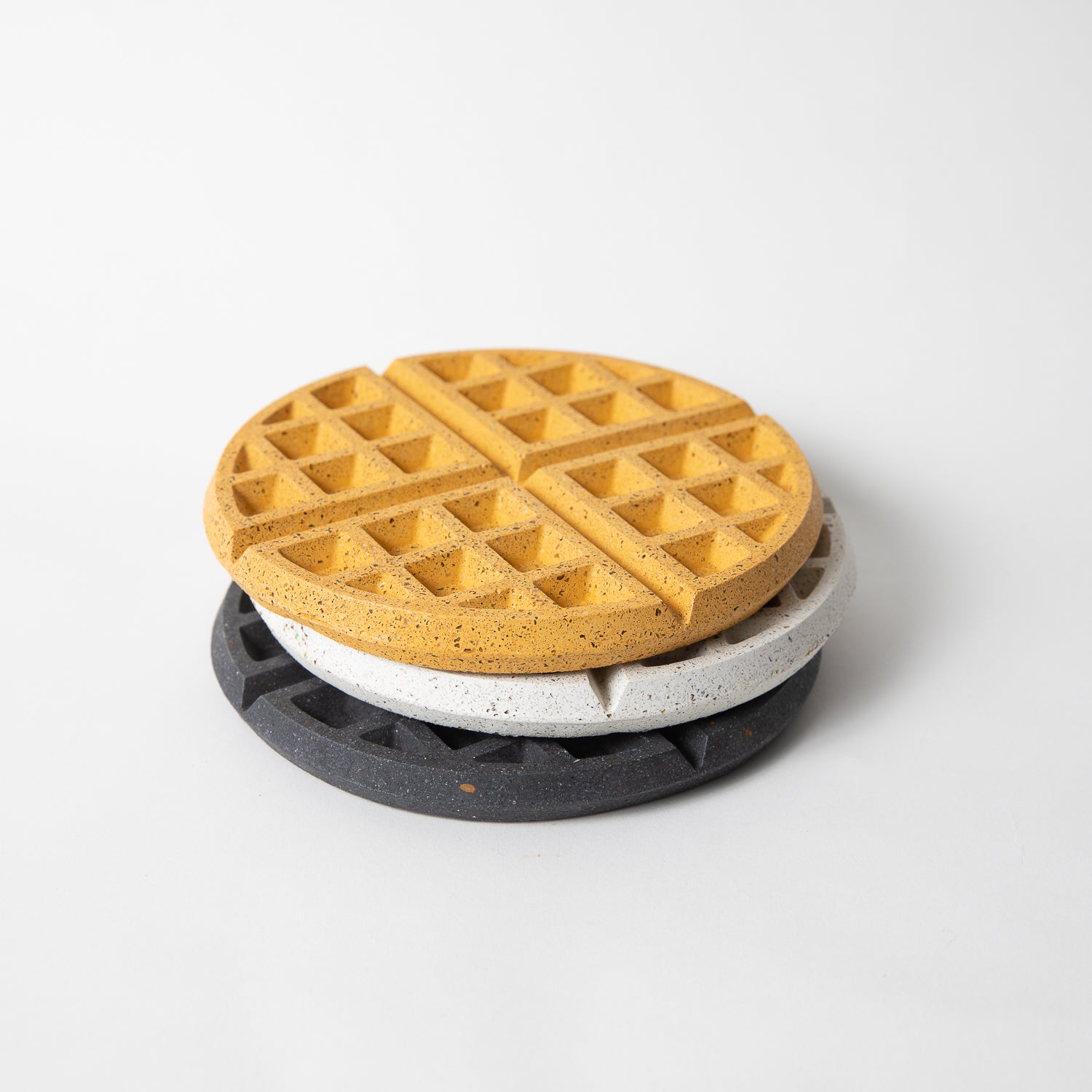 Concrete waffle shaped trivet in various colors