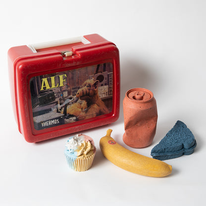 Set of concrete food shaped items with vintage Alf lunch box