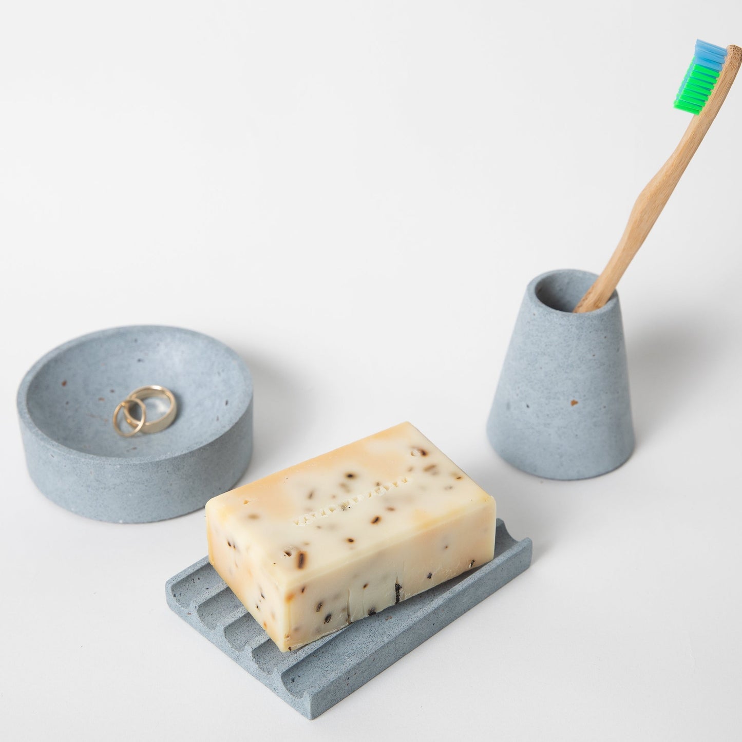 Soap dish, toothbrush holder, and a 4" catch all in light blue terrazzo.