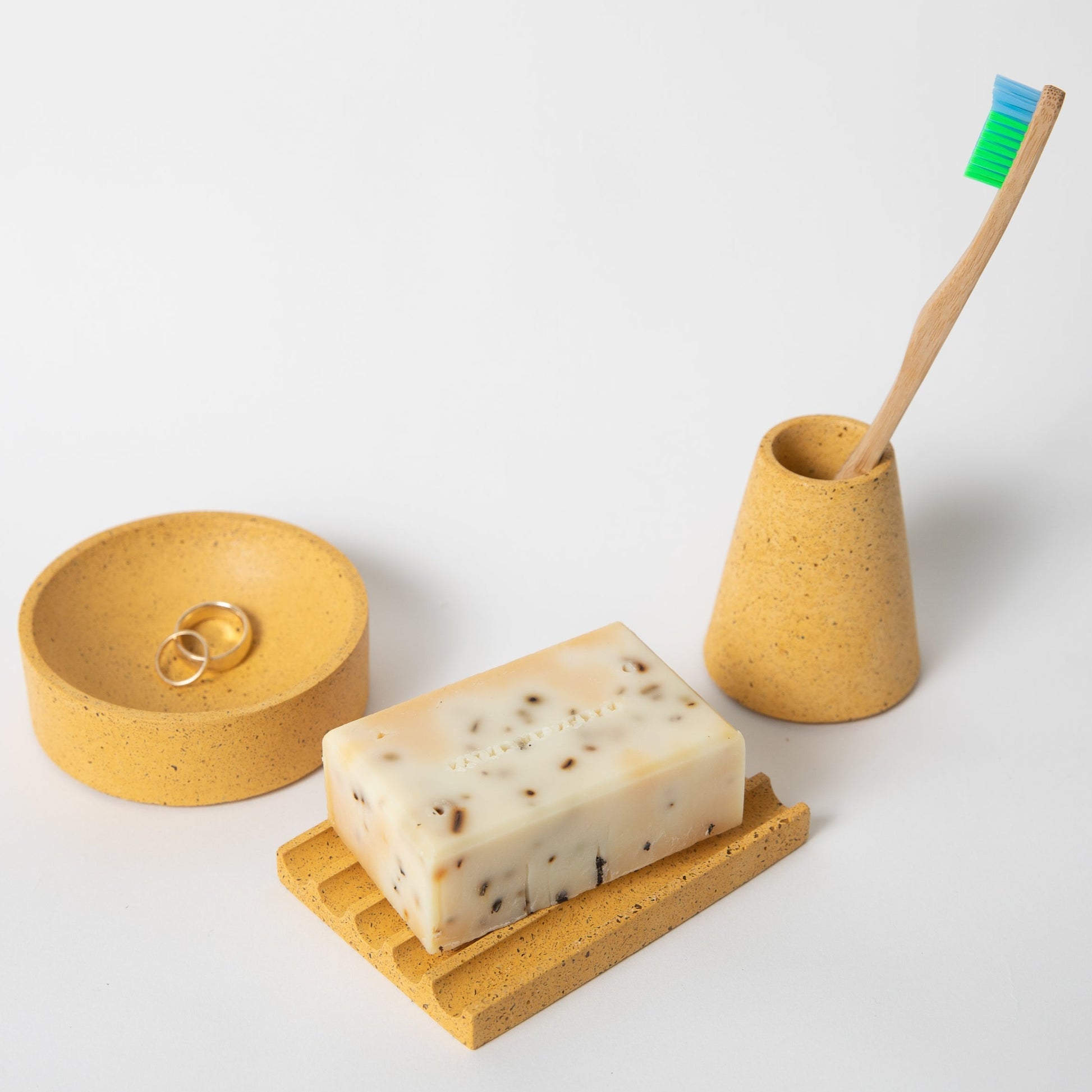 Soap dish, toothbrush holder, and a 4" catch all in marigold terrazzo.
