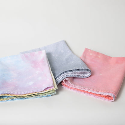 Hand dyed speckled tea towel with hang loop in various colors.