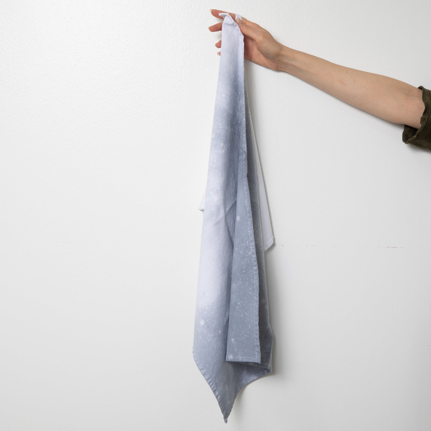 Hand dyed speckled tea towel with hang loop in grey and white.