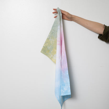 Hand dyed speckled tea towel with hang loop in jawbreaker (multicolor).