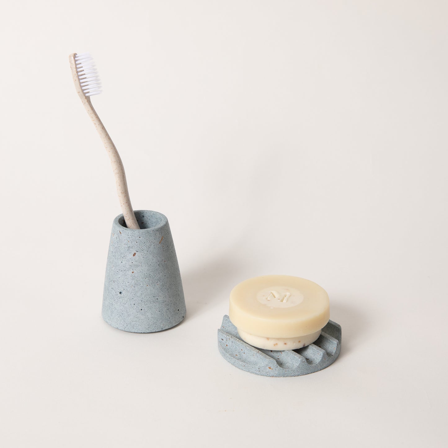 The mini soap dish & toothbrush holder set in light blue terrazzo.