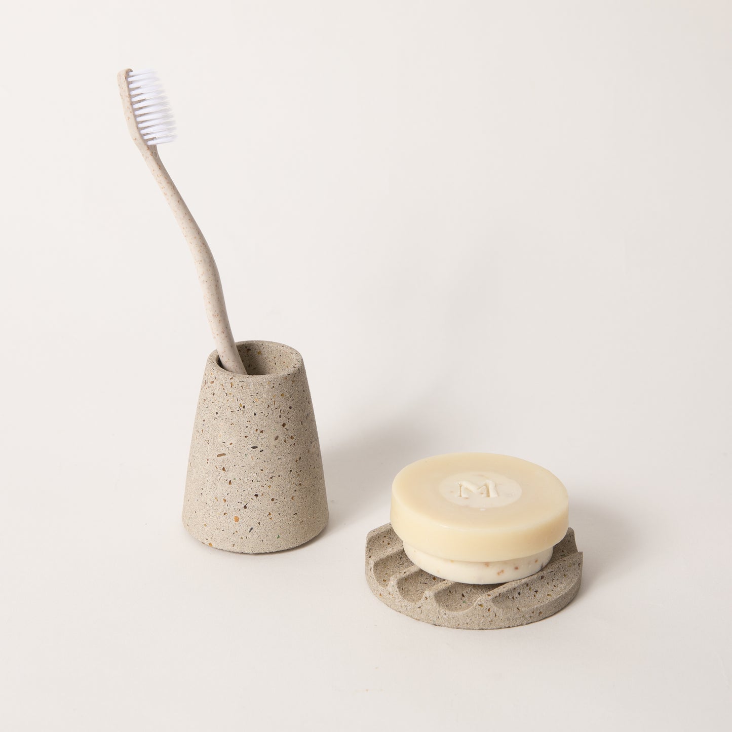 The mini soap dish & toothbrush holder set in natural terrazzo.