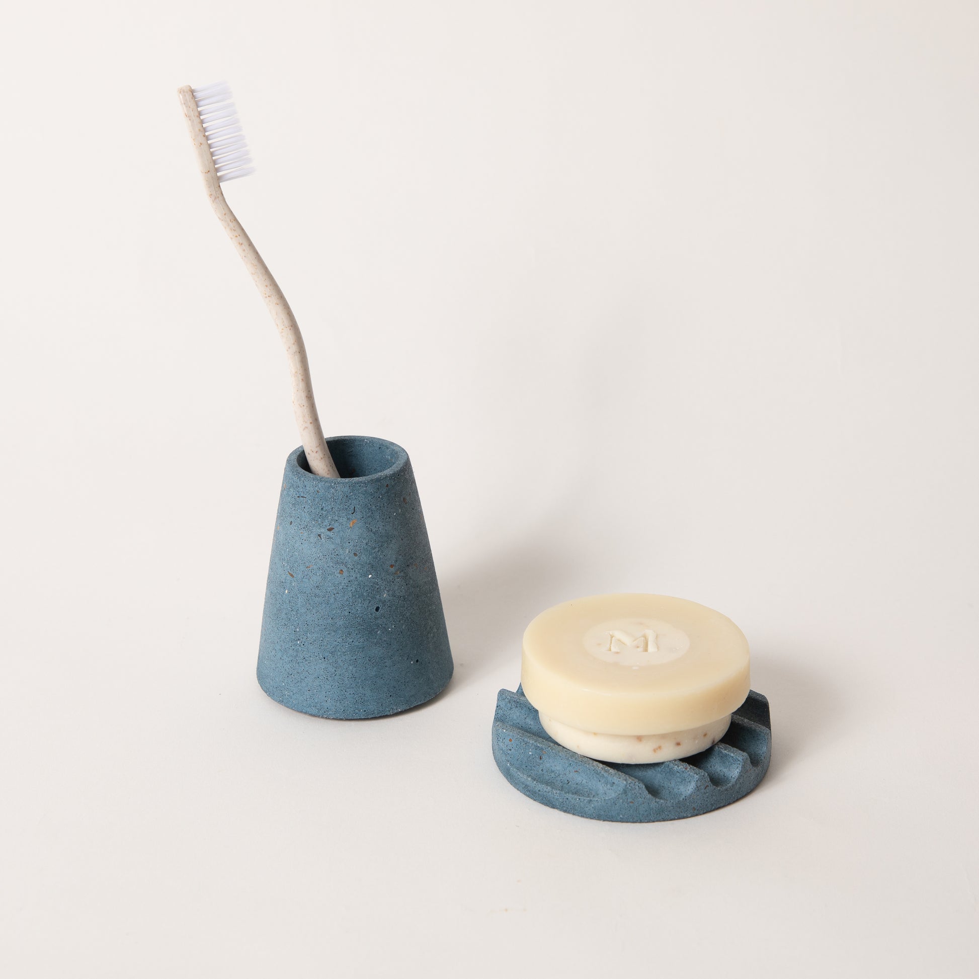 The mini soap dish & toothbrush holder set in cobalt terrazzo.