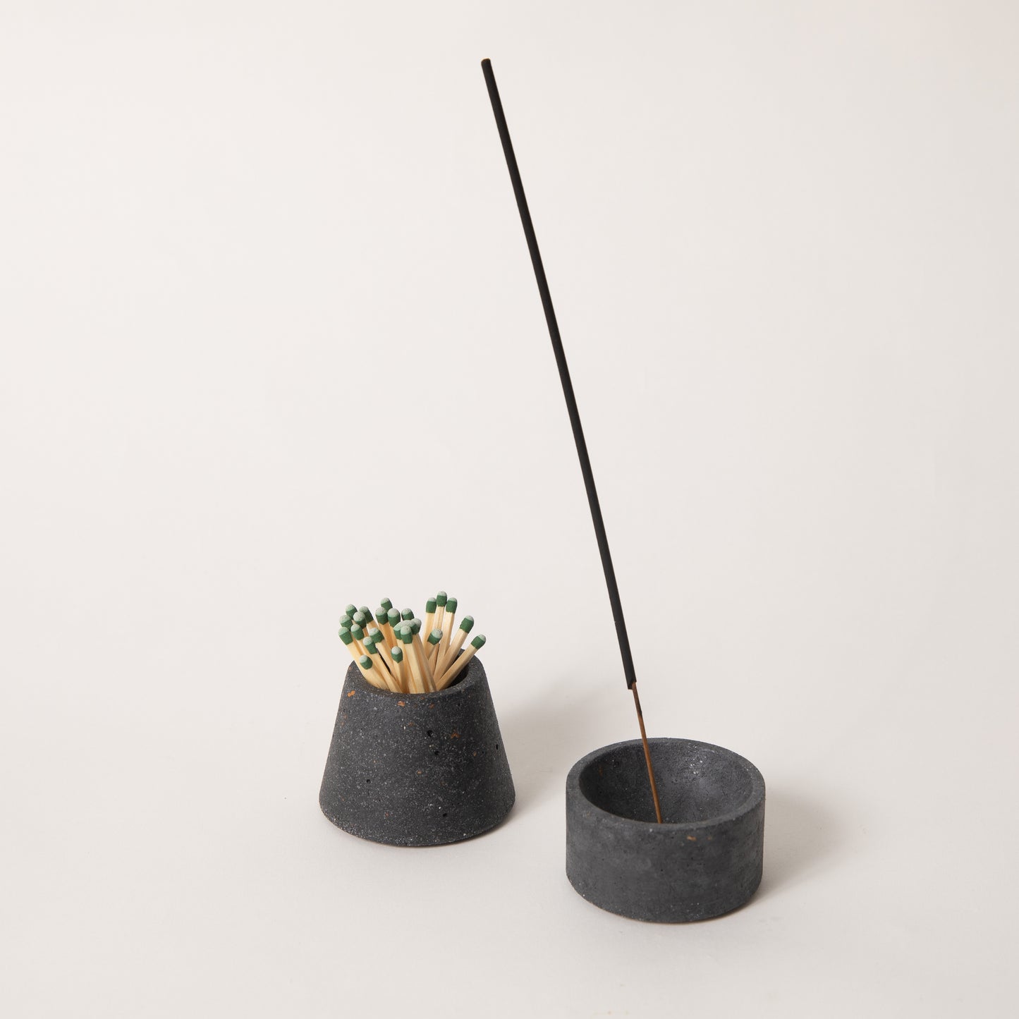 Black terrazzo matchstick & incense holder set, styled with strike-anywhere matches & an incense stick.