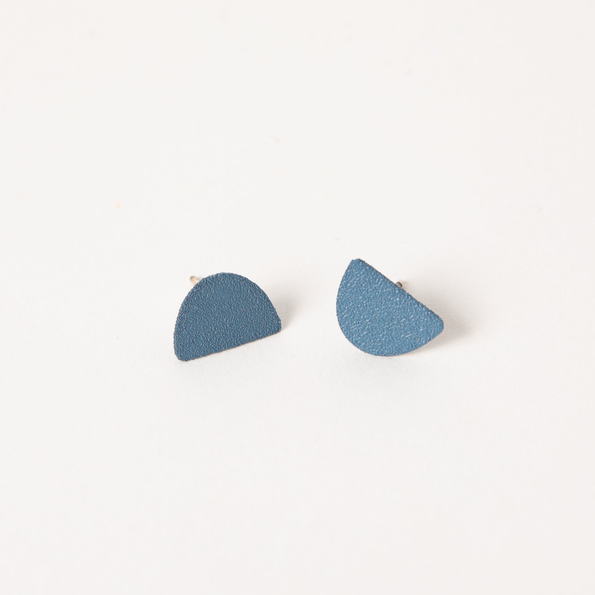 Mound earrings in cobalt.