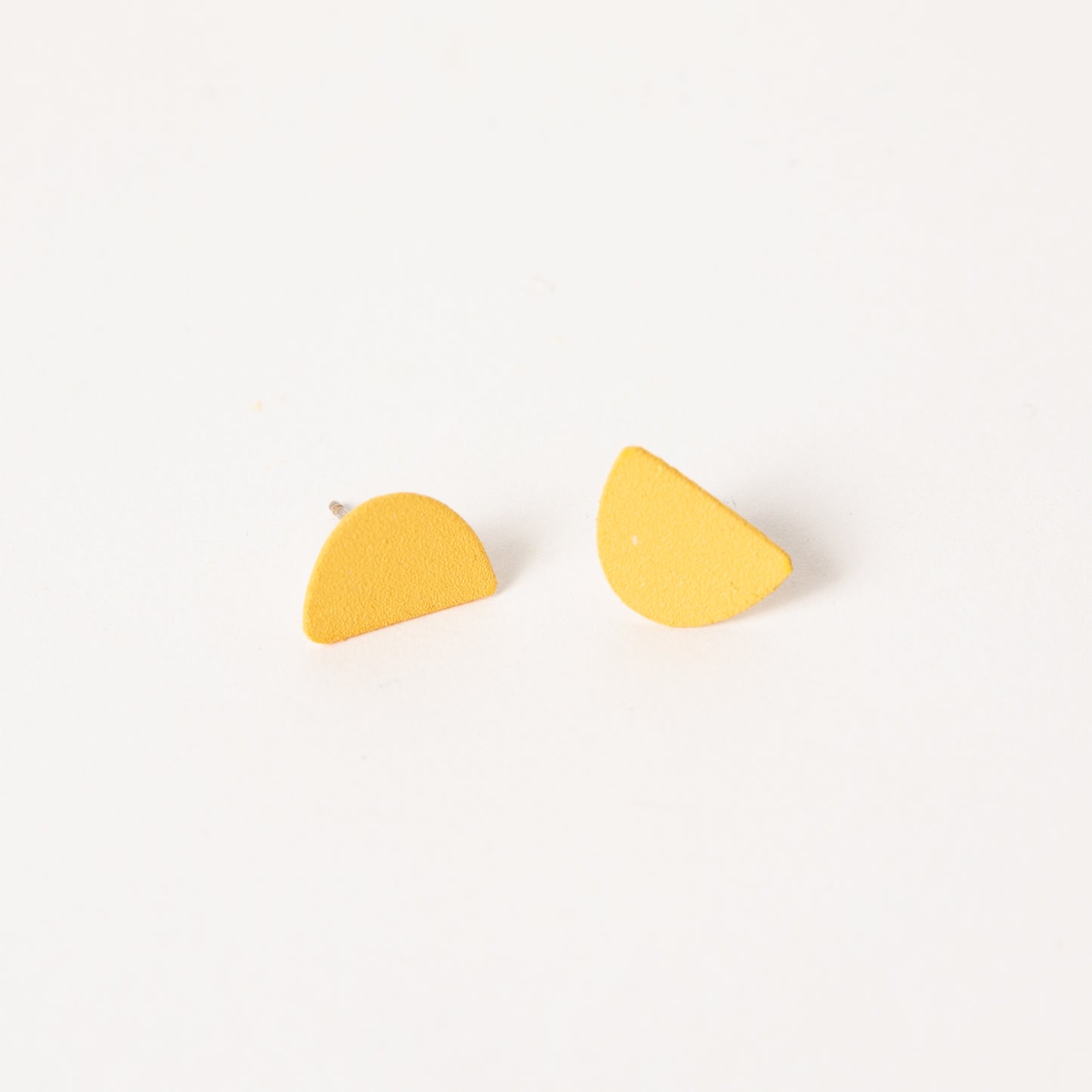 Mound earrings in marigold.