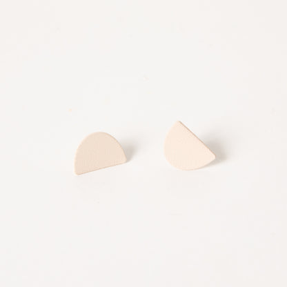 Mound earrings in cream.
