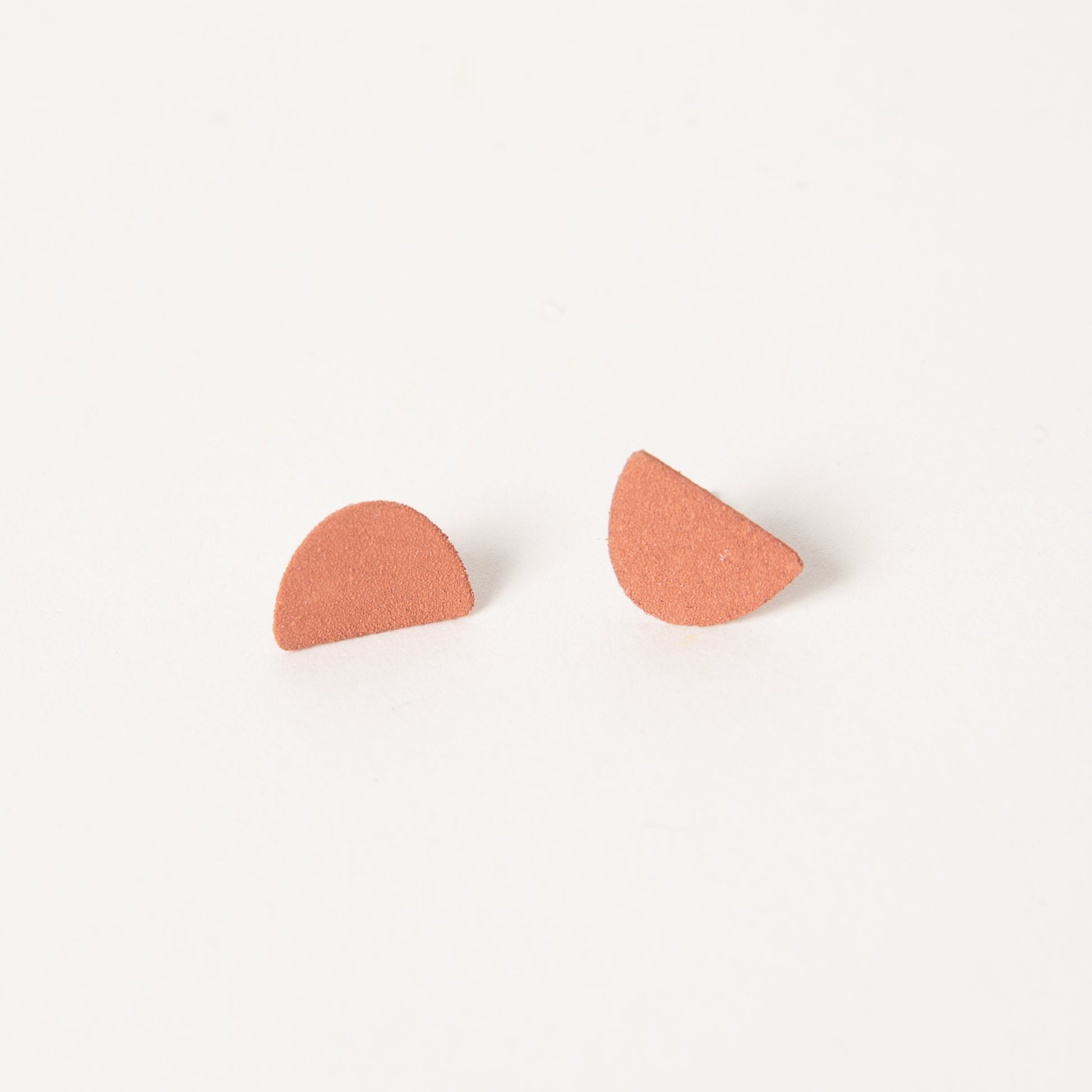 Mound earrings in coral.