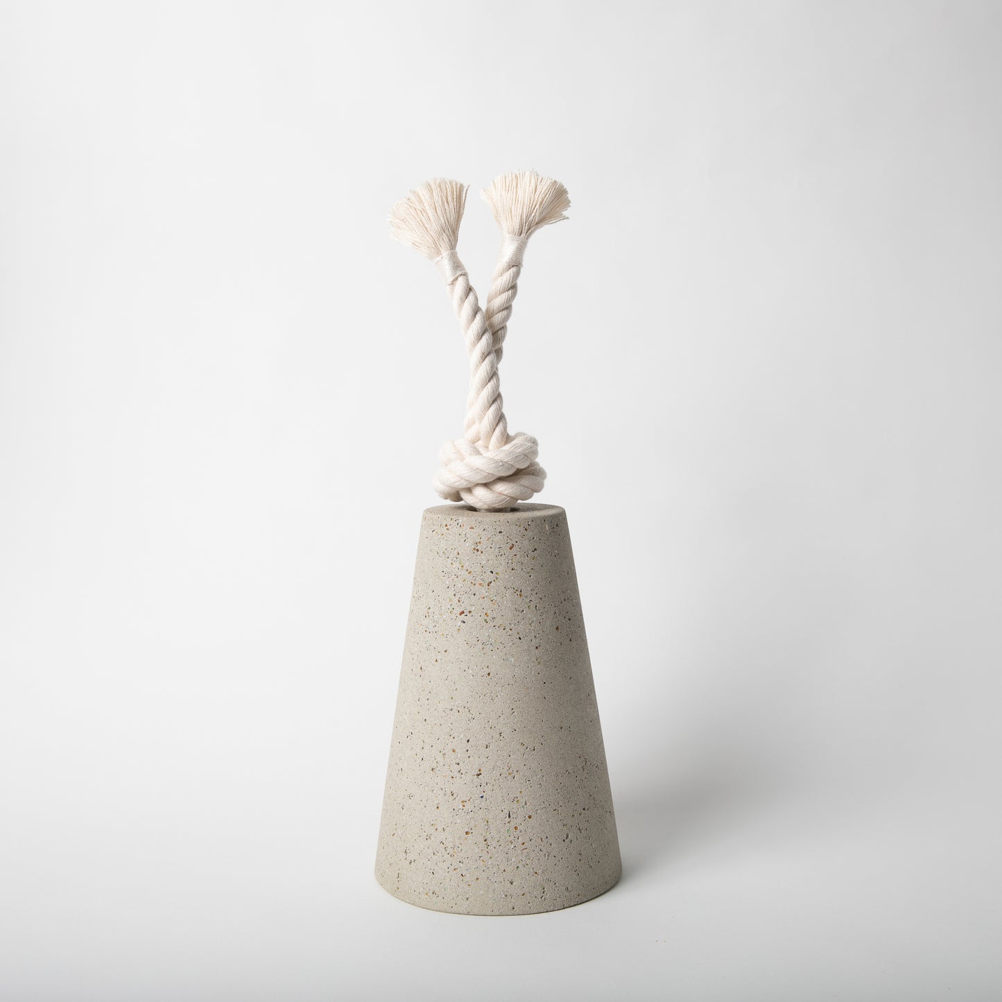 Concrete terrazzo doorstop with cotton rope in natural.