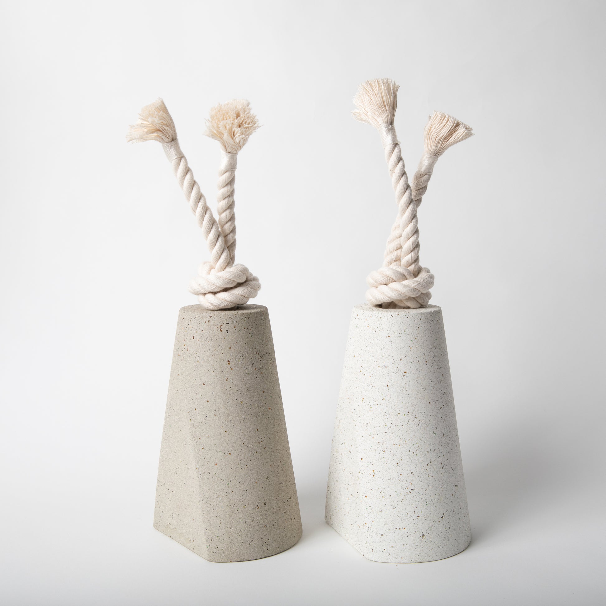 Concrete terrazzo doorstop with cotton rope in both colors side by side.