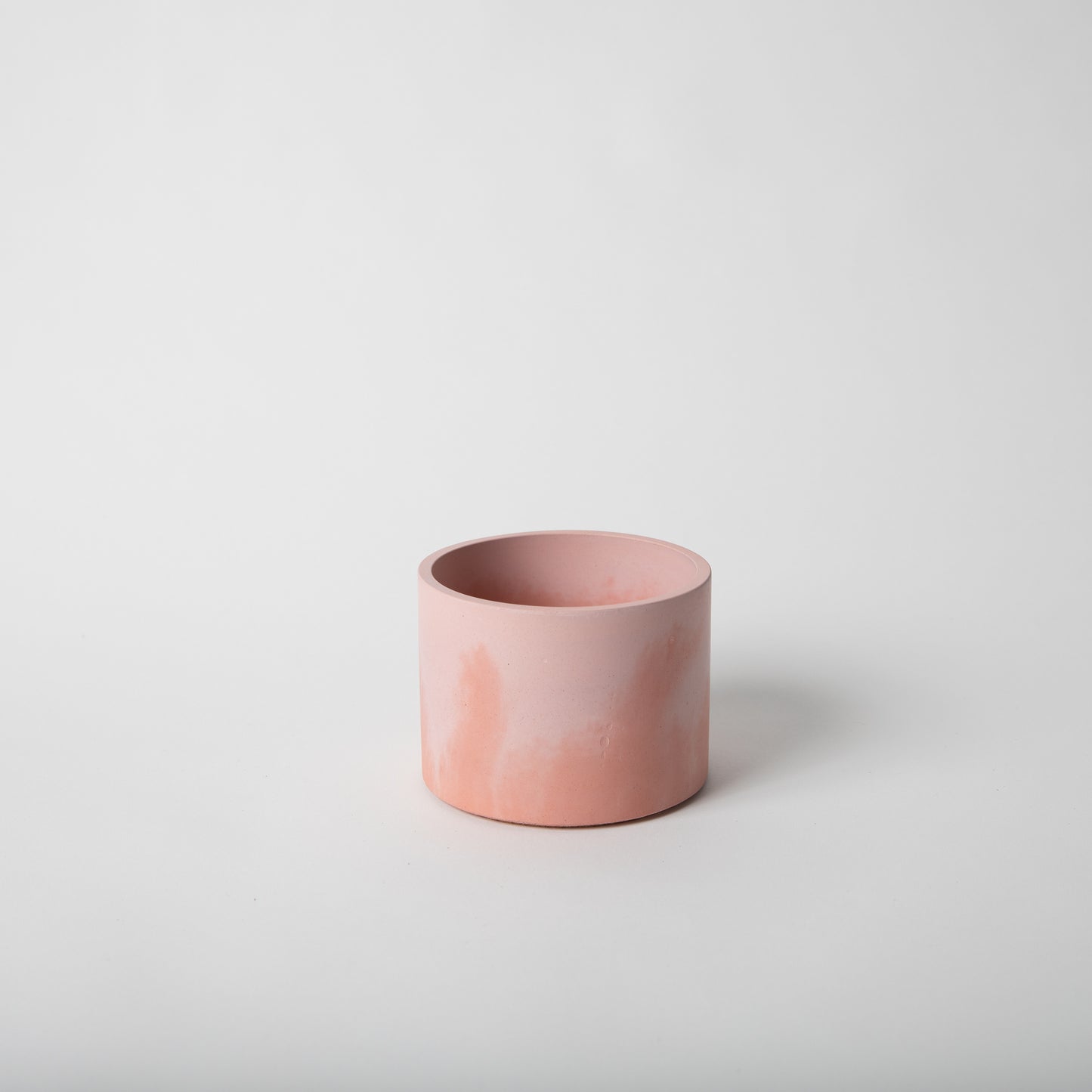 4 inch concrete vessel with cork base in pink and coral.