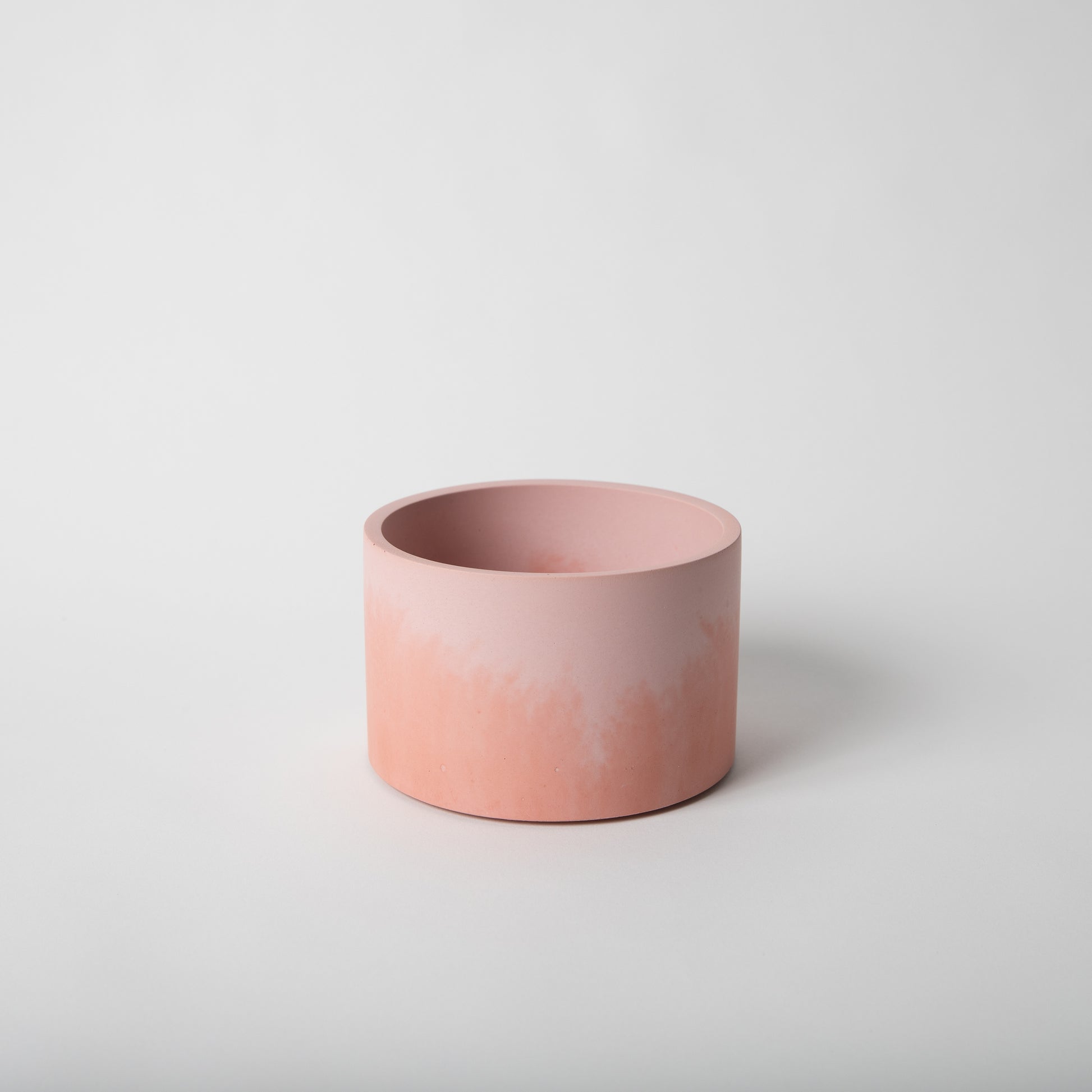 5 inch concrete vessel in pink and coral.